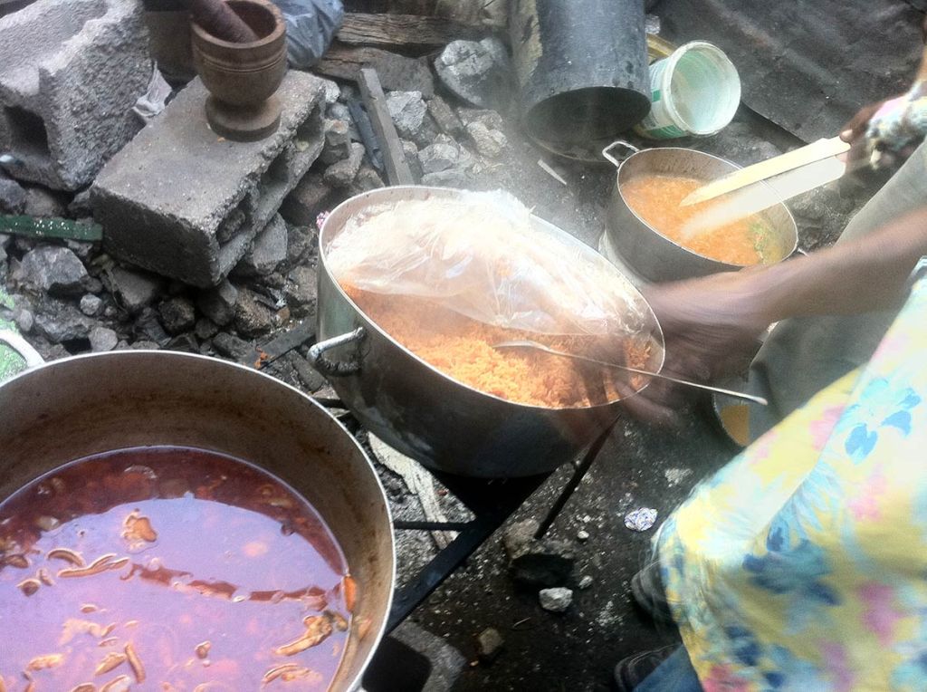 Rose-Marie prepares Haitian cuisine for the 2013 Ghetto Biennial, Port-au-Prince, Haiti