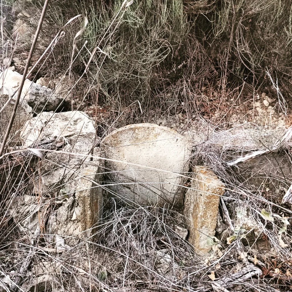 Lee Lee: Landscape photograph of abandoned acequia that lay like bones across the fields above Blanca, Spain taken while on an artist residency at AADK