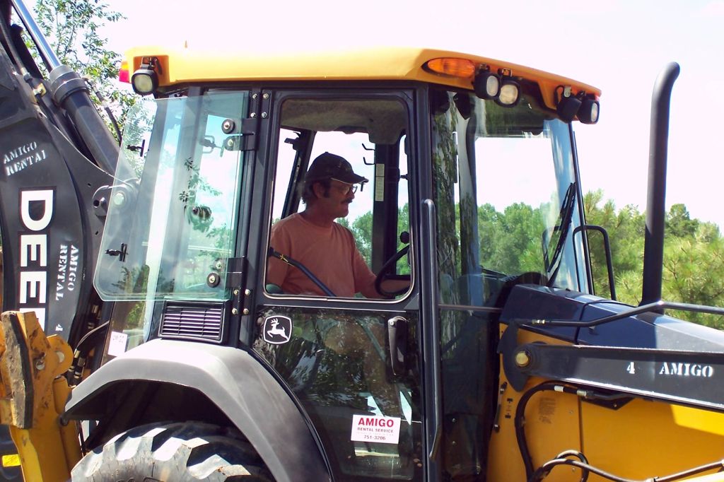 TAOS distillery: Casita construction - preparing the foundation for Grandpa's live-in greenhouse.
Peter T Leonard driving the back-hoe